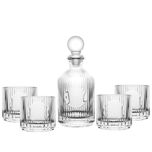 Set of clear glass decanter and tumblers on a white background