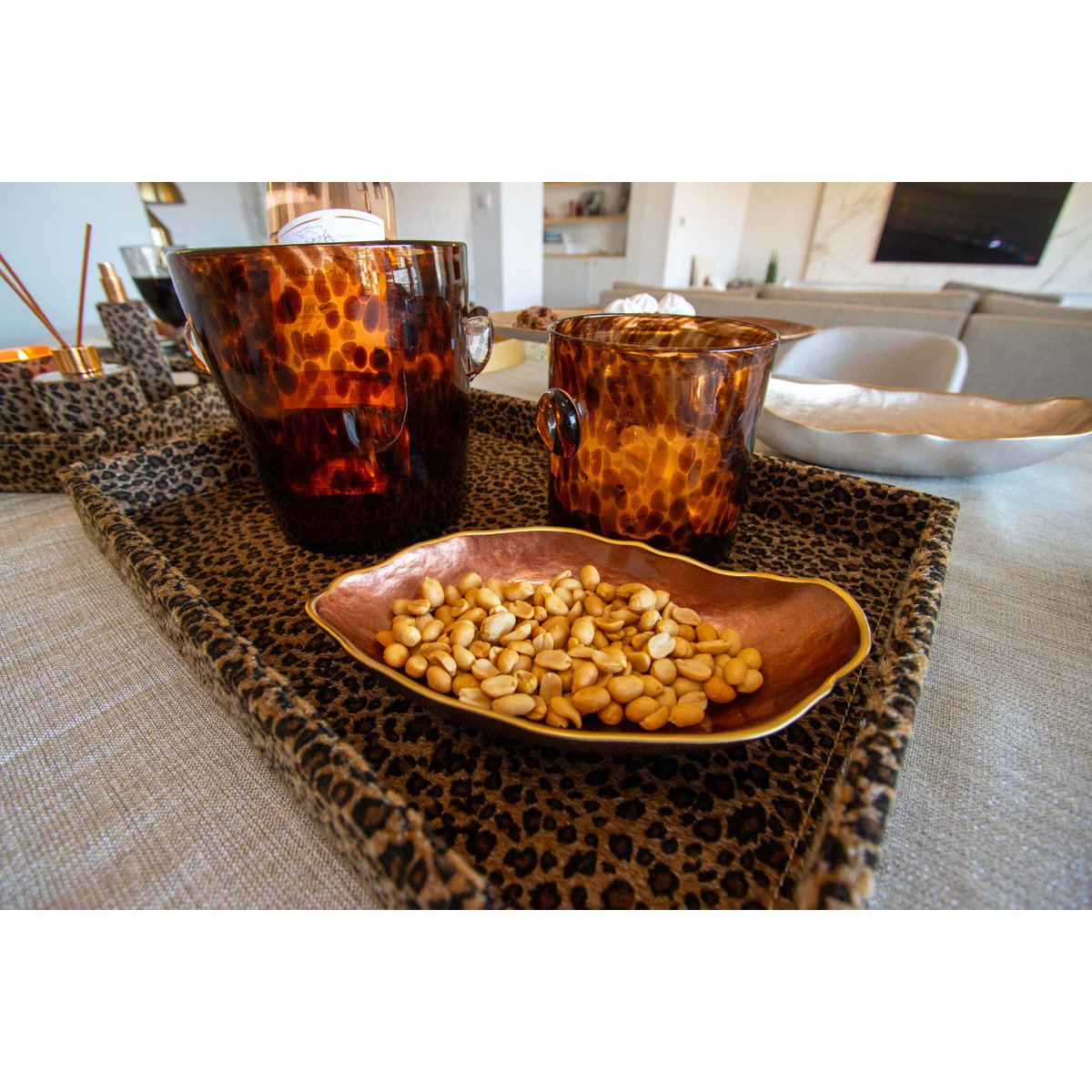 Decorative brown glass oval bowl with subtle golden edge detail
