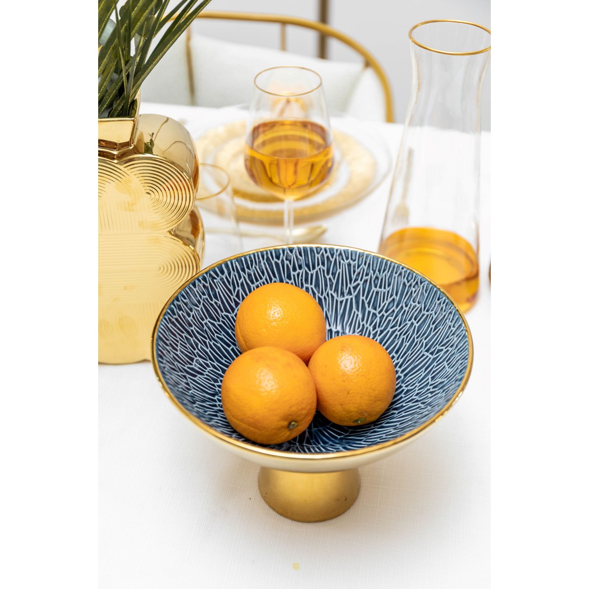 Stylish ceramic fruit bowl in gold and blue the cozy vibe
