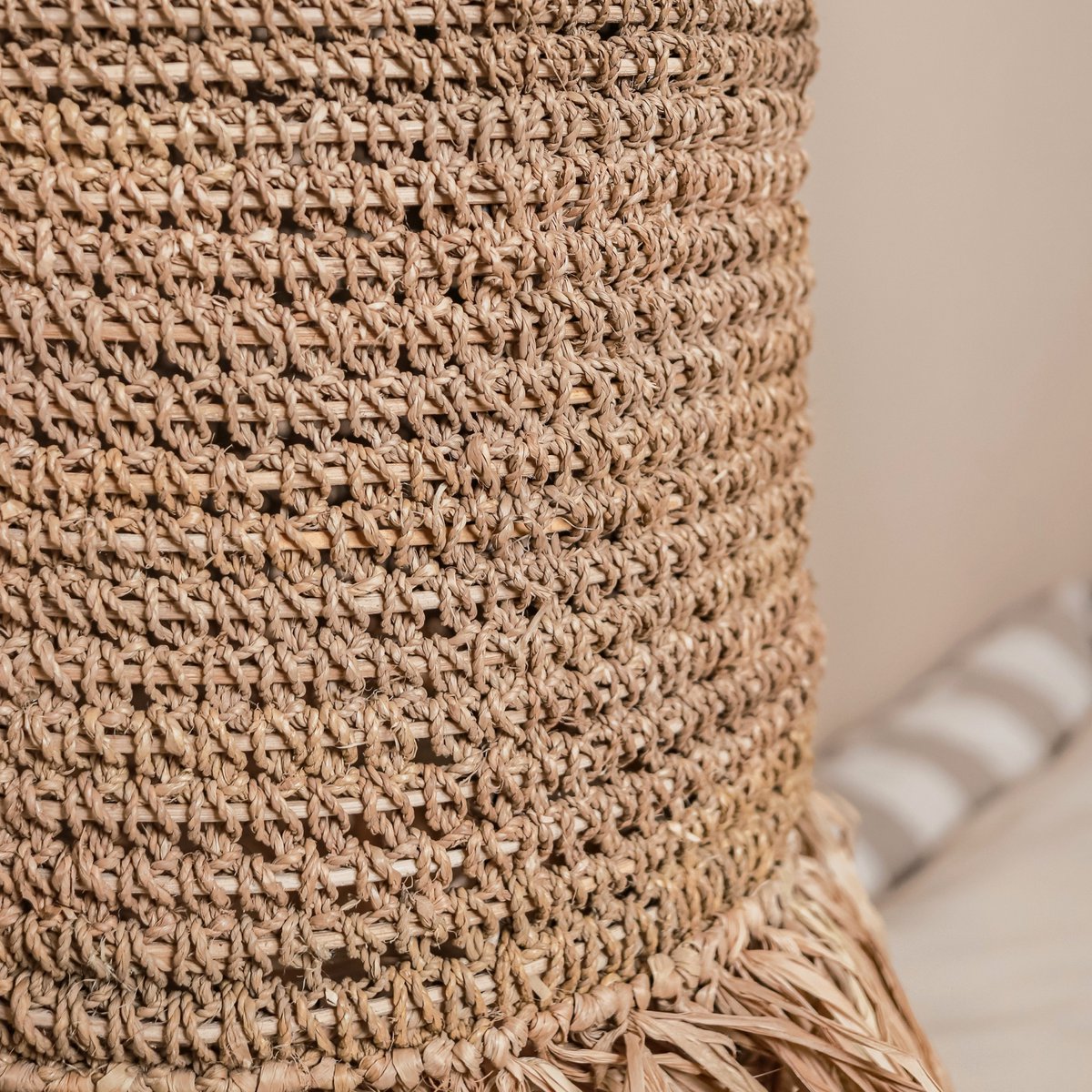 Handwoven raffia pendant lamp adding cozy style to home décor by CozyVibe